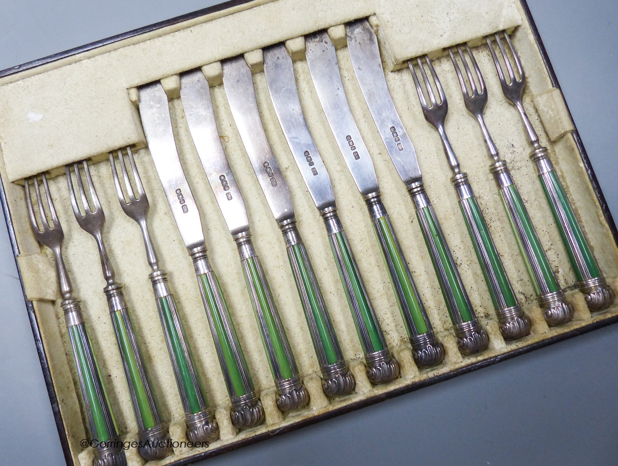 Six pairs of late Victorian stained ivory and silver fish eaters, George Howson, Sheffield, 1900.